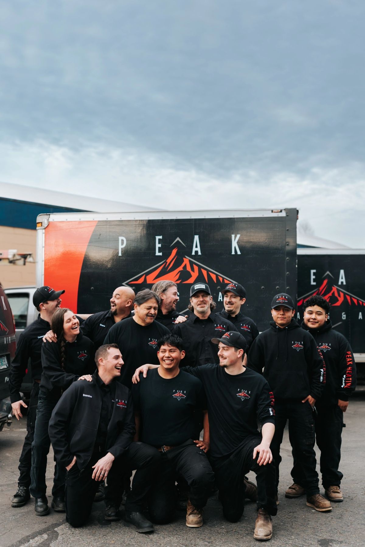 Peak Heating & Air crew posing together outside